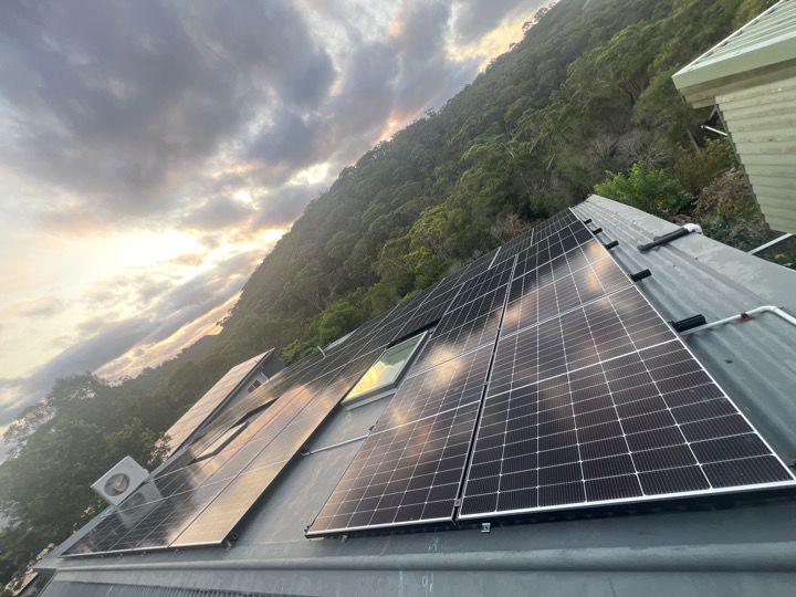 Sinvesta solar array on a Sydney hillside home at sunset.