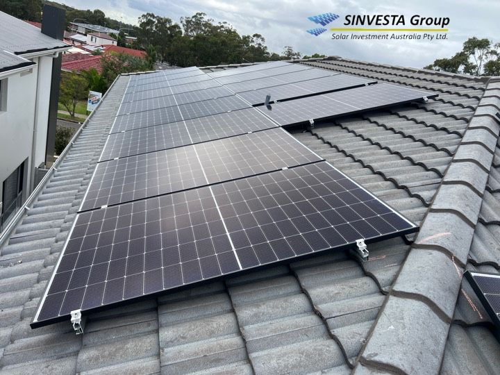 Solar panels on a tiled residential roof.